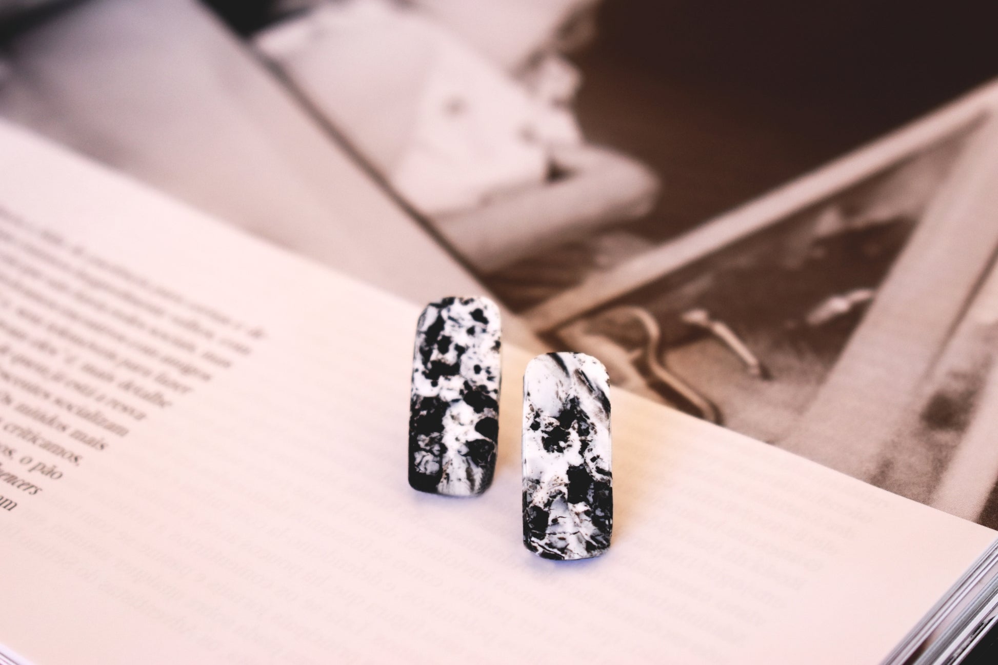 Black and white marble effect rectangle stud earrings handmade from polymer clay by Vertseas