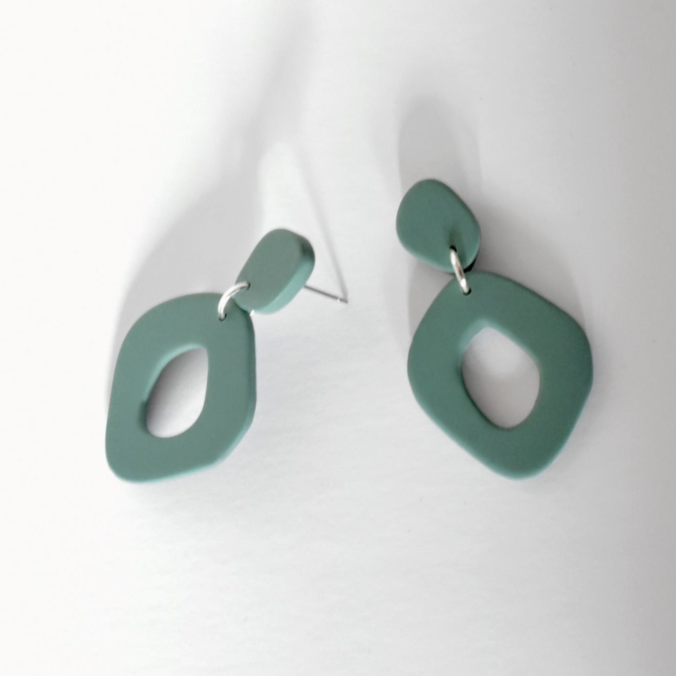 Sage Green organic shape statement hoop earrings handmade from polymer clay.