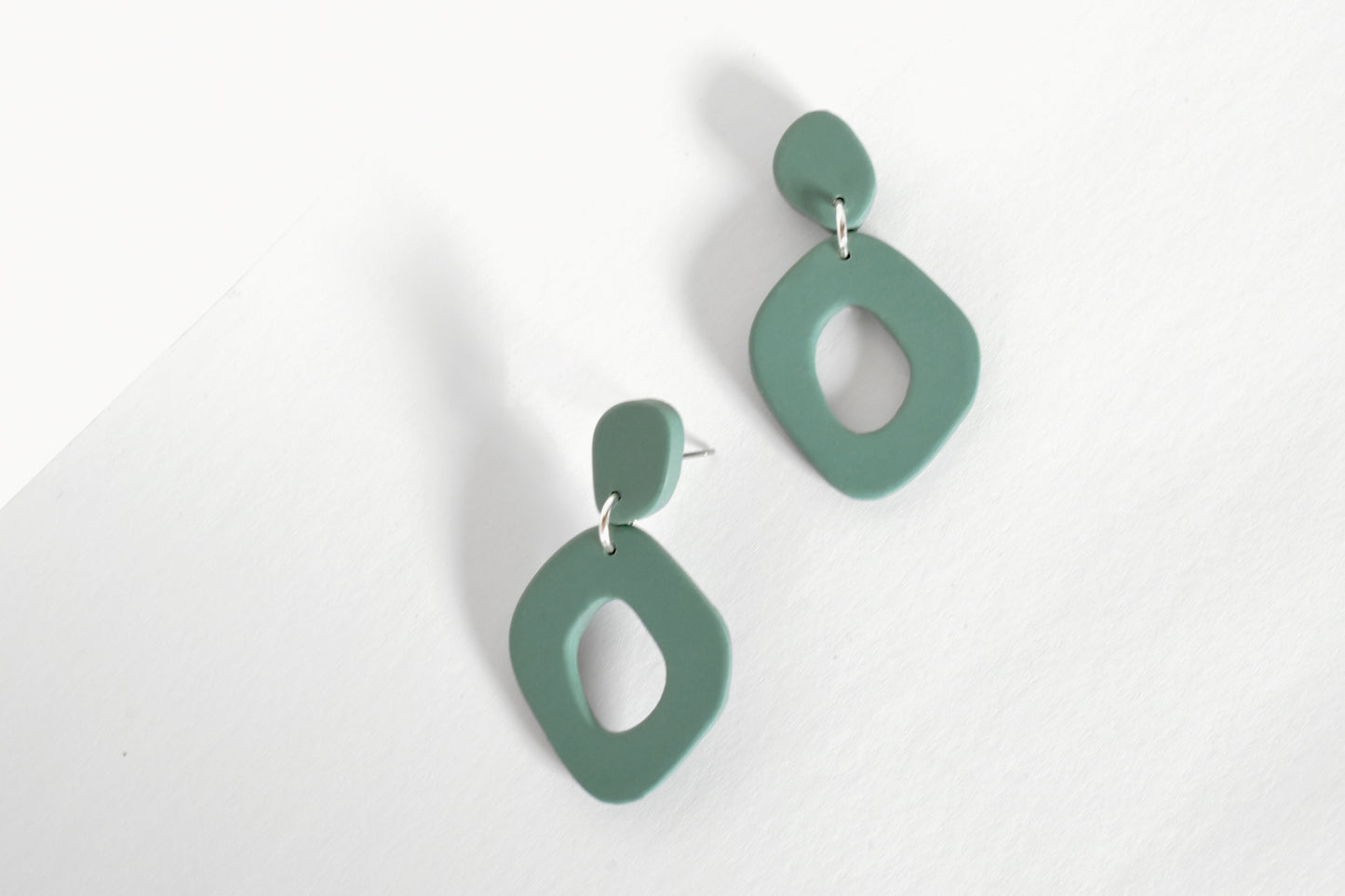 Sage Green organic shape statement hoop earrings handmade from polymer clay.