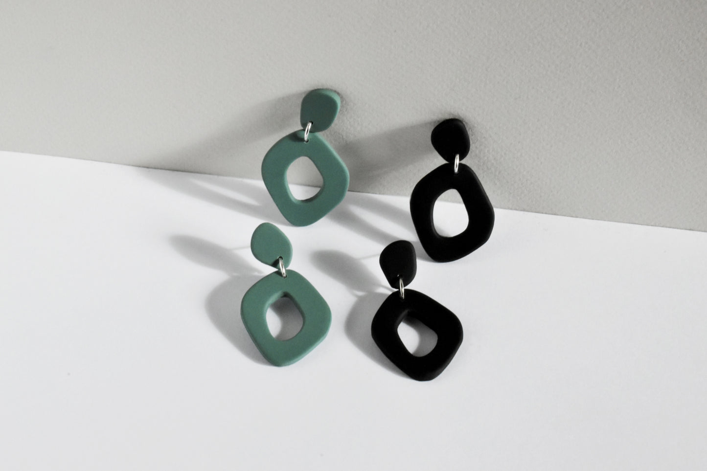 Sage Green and Matte black organic shape hoop earrings handmade from polymer clay.